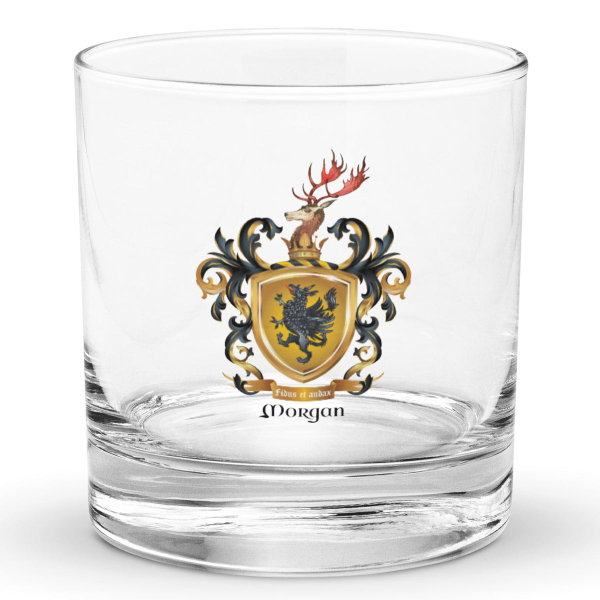 A clear classic heavy base rocks glass on a white background, printed with the Morgan Family Coat of Arms featuring a black griffin on a gold shield with a stag on the crest.
