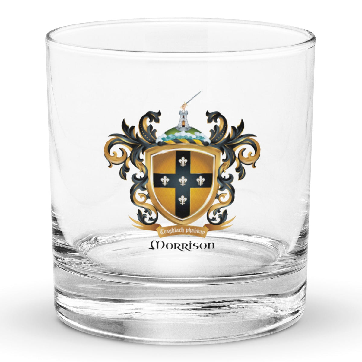 A clear classic heavy base rocks glass on a white background, printed with the Morrison Family Crest featuring a blqck cross with 5 fleur de lis on a gold shield.