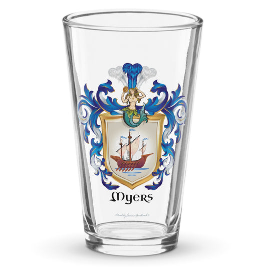 A clear classic pint beer glass on a white background, printed with the Myers Family Coat of Arms featuring a wooden galley ship on a white shield with a mermaid at the crest of the shield.