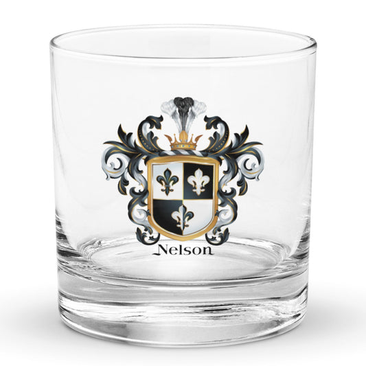 A Nelson rocks glass with the Nelson Family Crest with 3 fleur de lis printed on it, pictured on a white background.