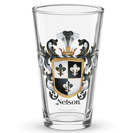 A pint beer glass with the Nelson Family Crest with 3 fleur de lis printed on it pictured on a white background.
