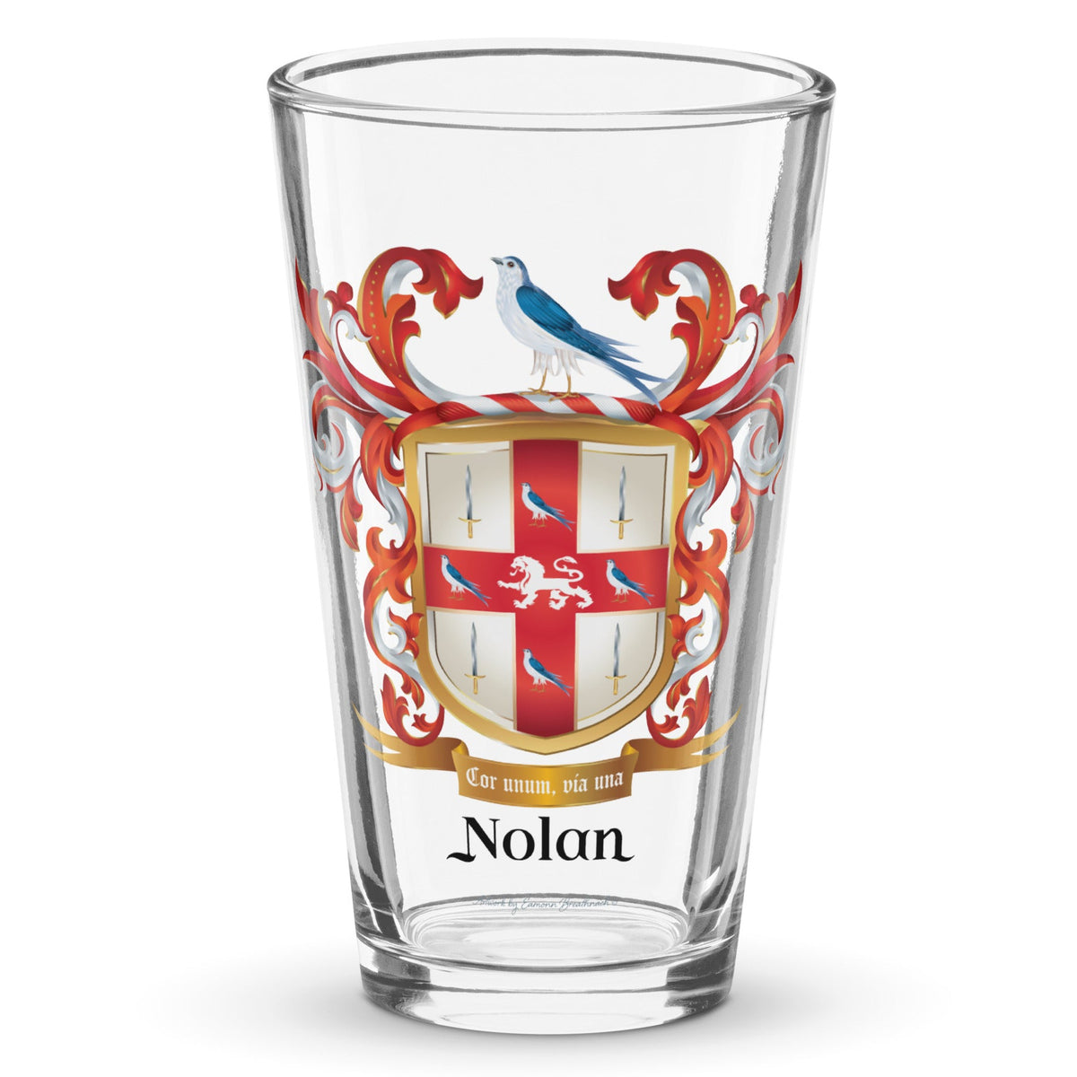 A clear classic pint beer glass on a white background, printed with the Nolan Family Crest featuring a white shield with red cross, 4 swords and doves and a white lion.