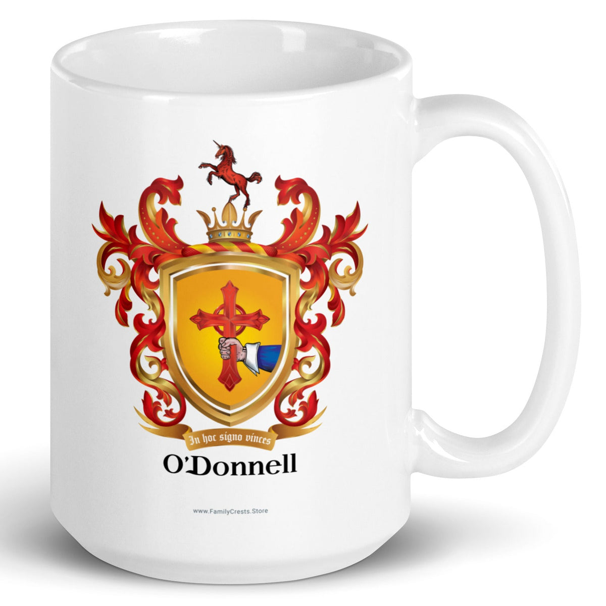 A white mug with the O'Donnell Family Crest featuring a hand holding a cross and a unicorn