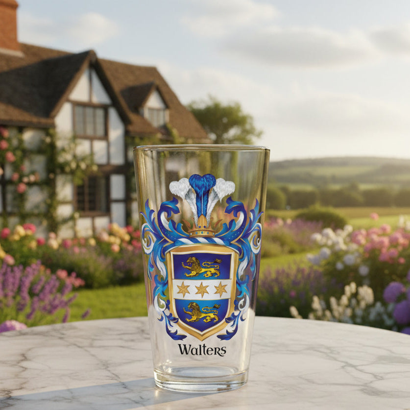 Pint glass with Walters family crest on an old marble tabletop with a landscape background with an old english Tudor style farmhouse on a sunny day in the background