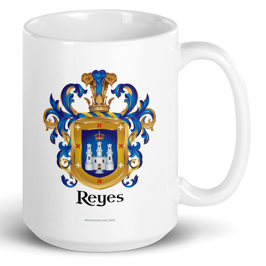A white mug on a white background, printed with the Reyes Family Crest which features a blue shield with a white castle and crown.