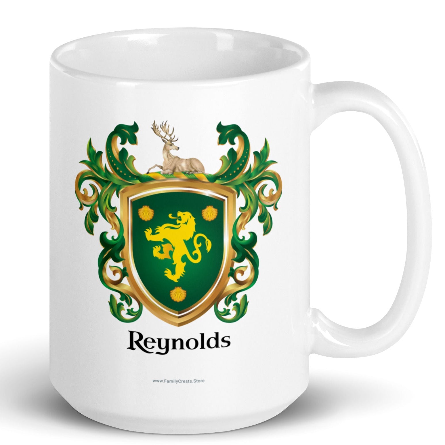 A white mug on white background with Reynolds Family Crest featuring a gold lion and 3 shells on a green shield with a stag resting on the crest of the shield, on front of the mug.