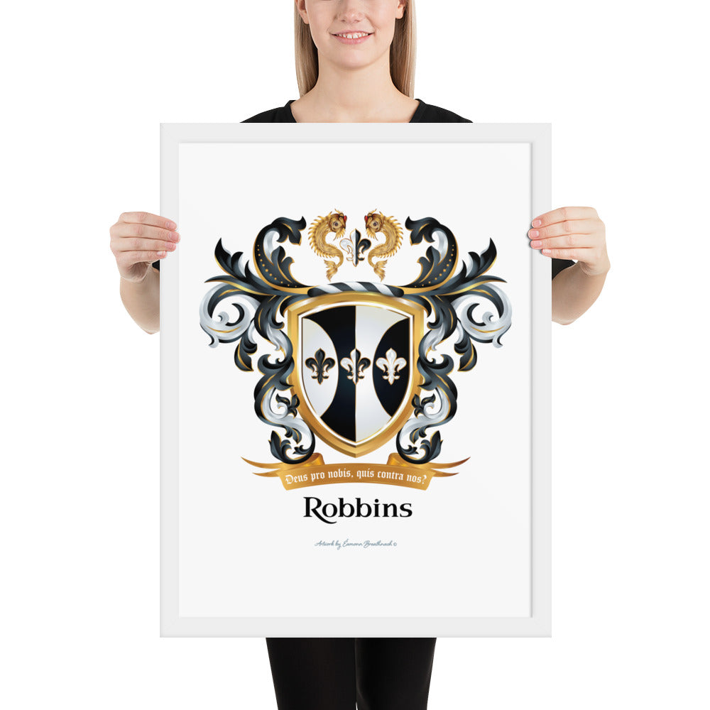 A woman holding a framed print of the Robbins family crest