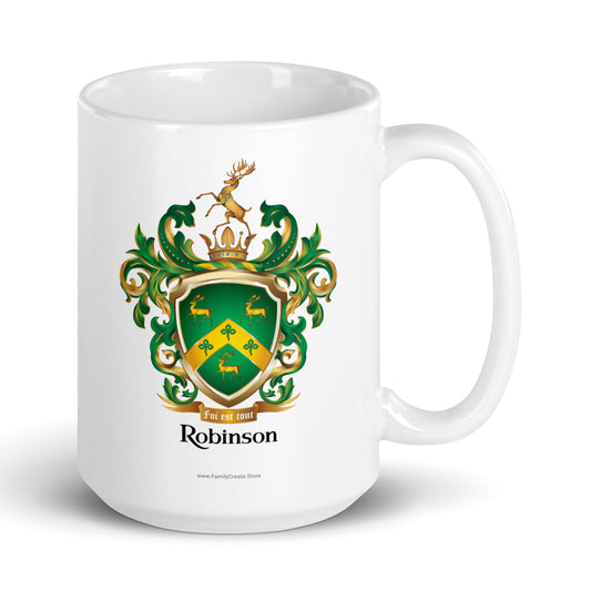 White mug with the Robinson-Family-Crest print on the front featuring a green shield with three gold stags, a golden chevron with 3 shamrocks and above the shield a stag standing on a gold crown and below the shield a motto and the name Robinson in black letters.