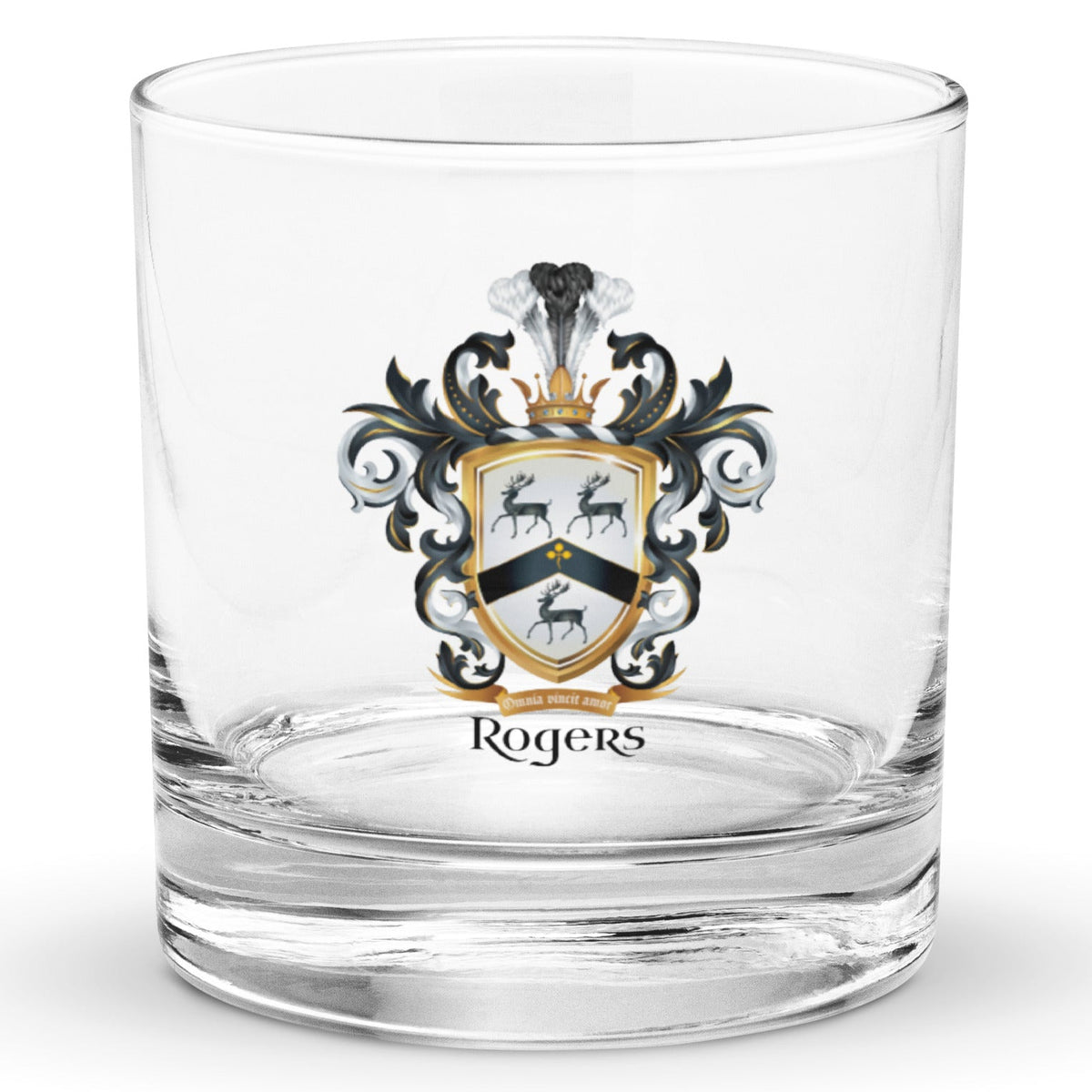 A clear classic heavy base rocks glass on a white background, printed with the Rogers Family Crest which features 3 black stags and a black chevron on a white shield.
