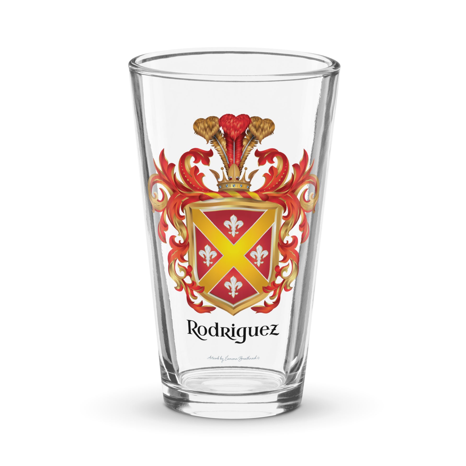 A pint beer glass with the Rodriguez Family Crest on the front featuring white fleur de lys with gold edges and a diagonal gold cross on a red shield of the coat of arms