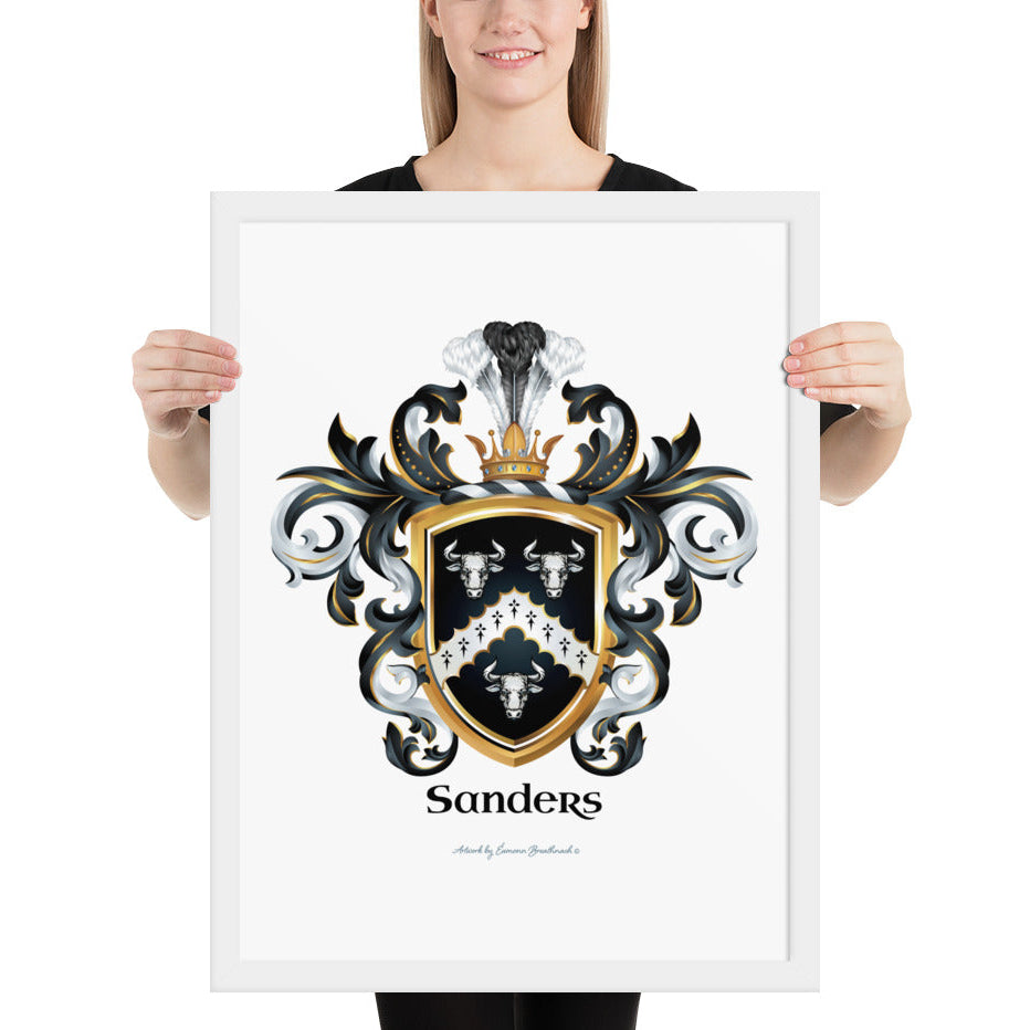 A woman standing in a white background, holding a white framed print of the Sanders Family Crest featuring 3 white bull heads and a chevron on a black shield.