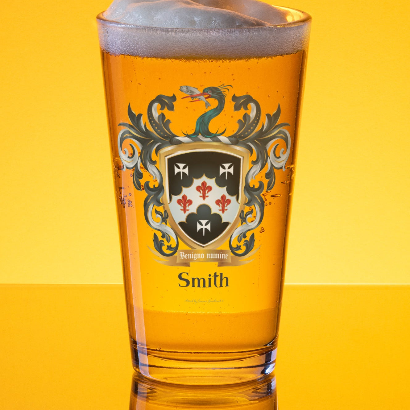 Pint glass with a Smith family crest design on a pint of golden beer