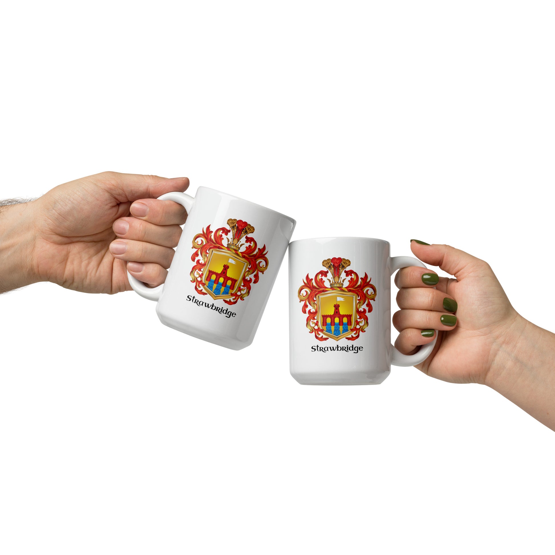 Two white ceramic mugs with the same heraldic coat of arms and the word 'Strawbridge Family Crest' printed below, held by two hands against a plain white background.