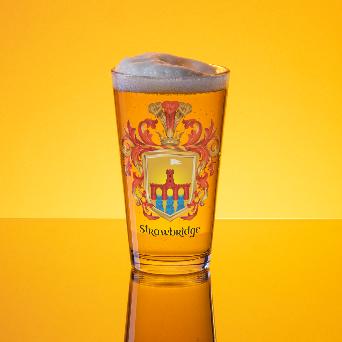 A clear pint glass filled with golden beer and topped with foam, featuring a printed coat of arms and the word 'Srewbridge' on the front, set against a bright yellow gradient background with a reflection below.