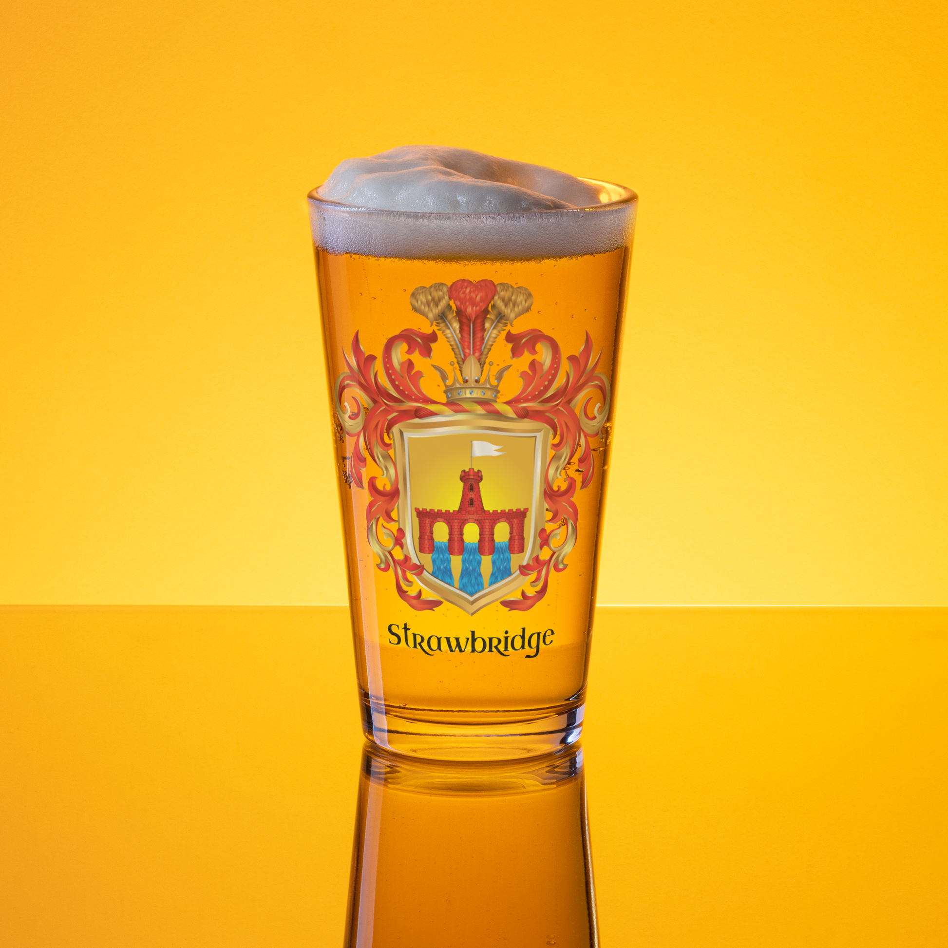 A clear pint glass filled with golden beer and topped with foam, featuring a printed coat of arms and the word 'Srewbridge' on the front, set against a bright yellow gradient background with a reflection below.