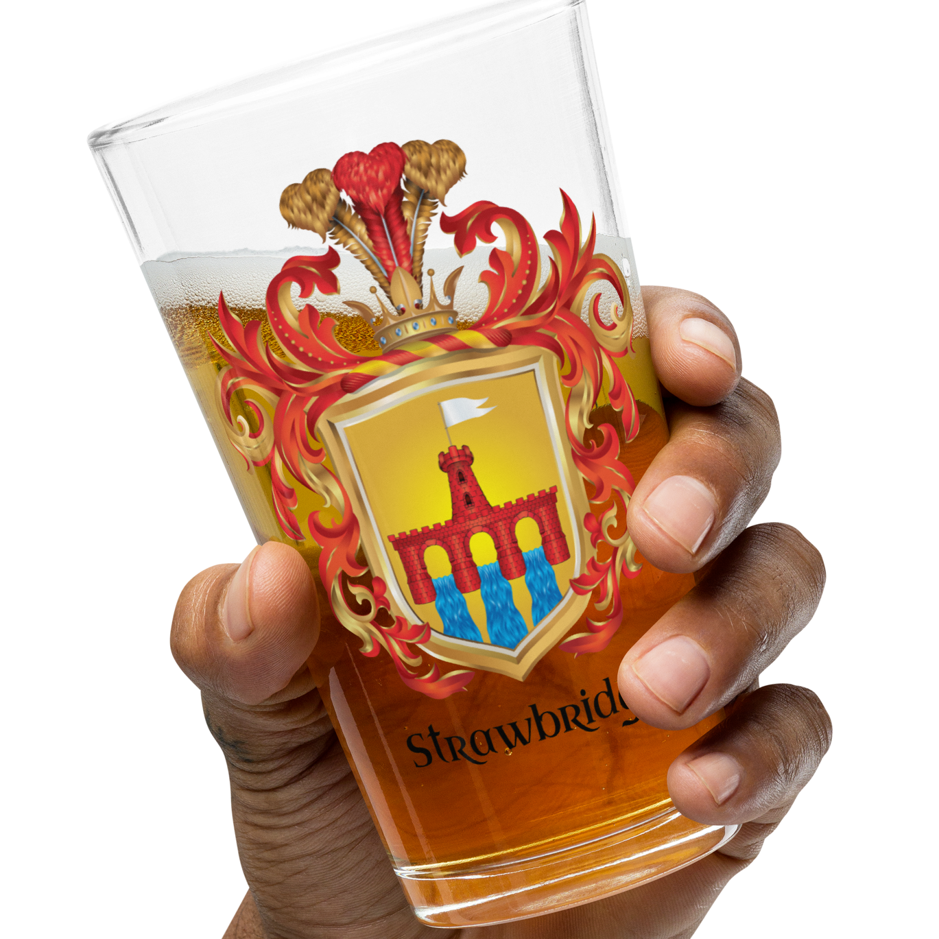 A hand holding a clear pint glass filled with amber beer, featuring a printed heraldic crest with red, gold, and blue details and the word 'Strawbridge' near the bottom, against a plain white background.
