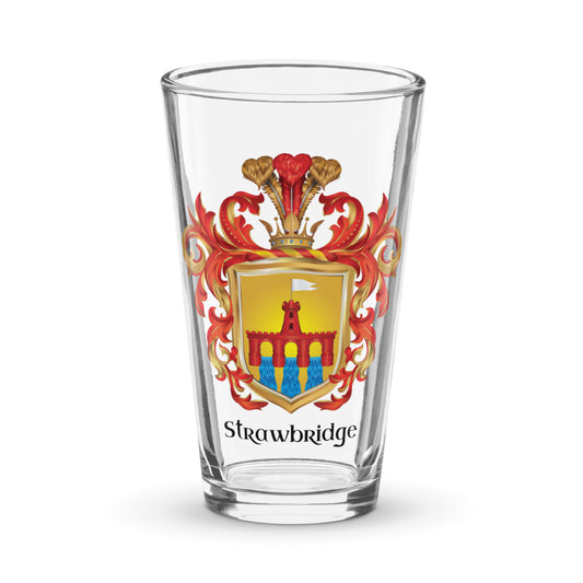A pint glass with on a white background with the Strawbridge Family Crest on the front of the glass
