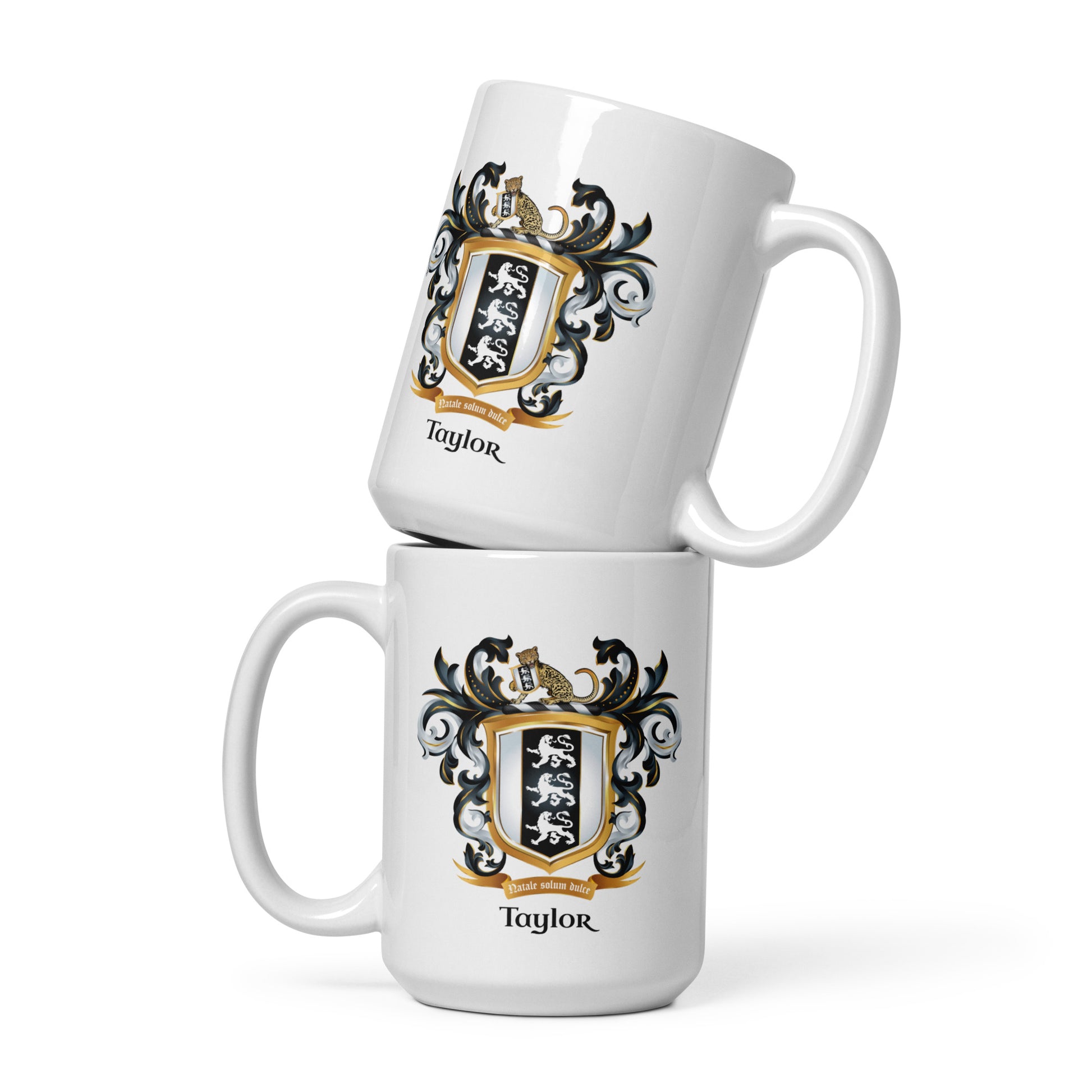 Two white mugs stacked on top of each other with a family crest and 'Taylor' text