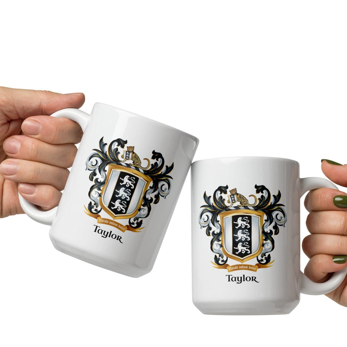 Two hands holding mugs with Taylor family crest and the name 'Taylor' in black text below the shield that has 3 white lions on a black and white shield on a white background