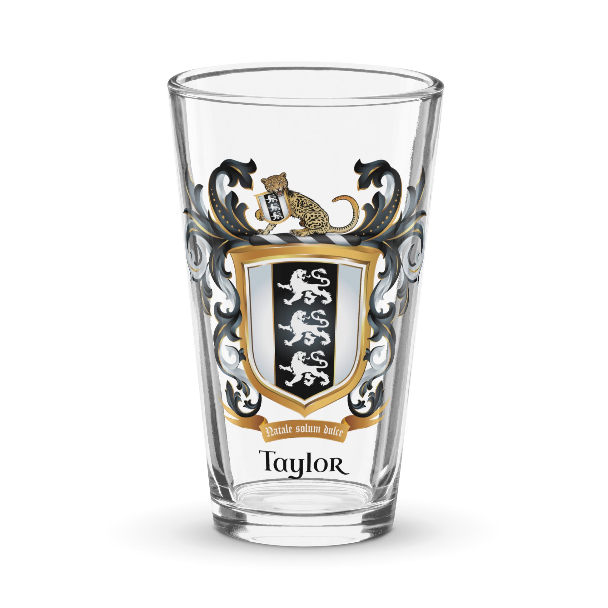 Clear pint glass with Taylor family crest and the name 'Taylor' in black text below the shield that has 3 white lions on a black and white shield on a white background 