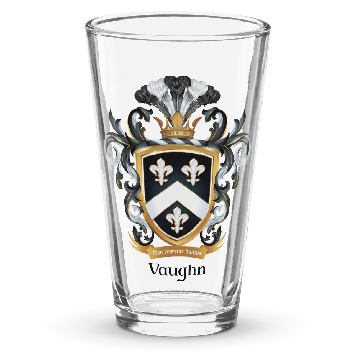 A clear classic pint beer glass on a white background, printed with the Vaughn Family Crest featuring a shield with 3 fleur de lis and a chevron.