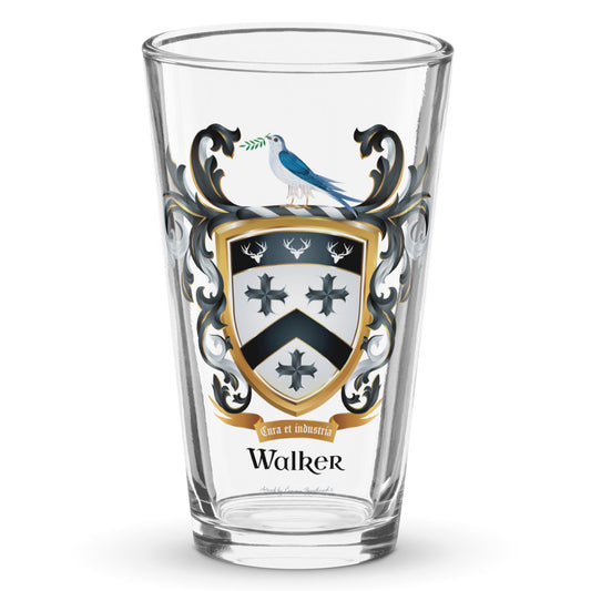 A clear classic pint beer glass on a white background, printed with the Walker Family Crest which features a white shield with 3 stags heads on a black band, 3 black crosses and a black chevron as well as a dove with an olive branch on the crest above the shield.