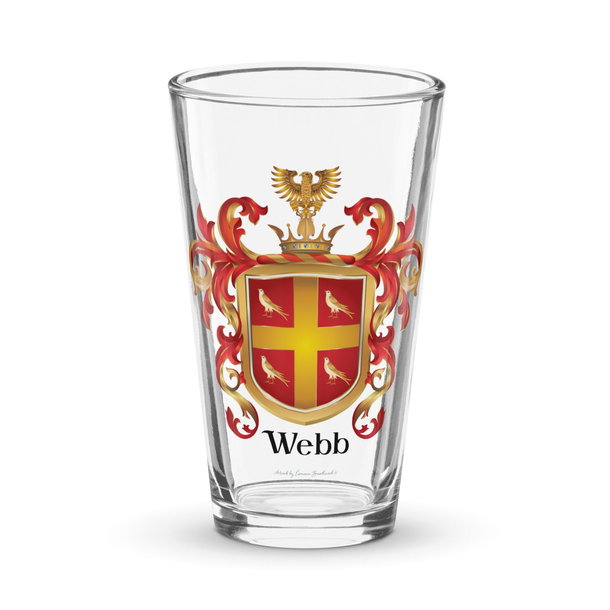 Pint glass with the Webb Family Crest on the front of it pictured on a white background. TYhe crest has 4 birds and a gold cross on a red shield