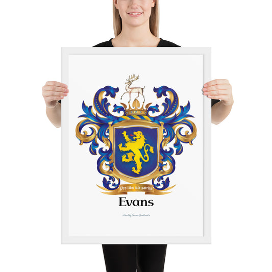 A woman holding a framed print of the Welsh origin Evans Family Crest with a gold lion on a blue shield with a stag on the crest printed on it. The frame is white and made of wood.