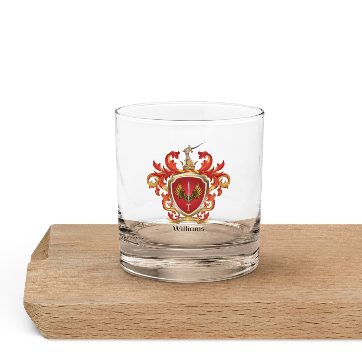 Clear glass with a Williams Family coat of arms design on a wooden block
