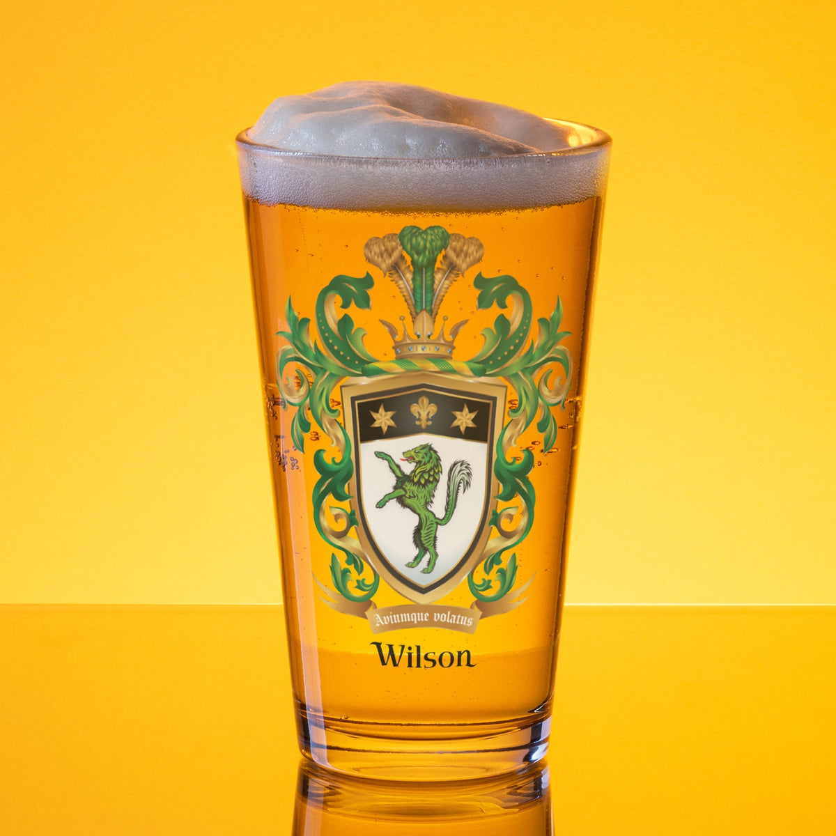 Glass of beer with a crest and 'Wilson' branding on a yellow background