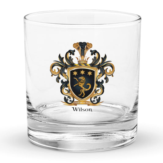 Wilson Family Crest rocks glass featuring coat opf arms with golden wolf abd gold stars in a black shield