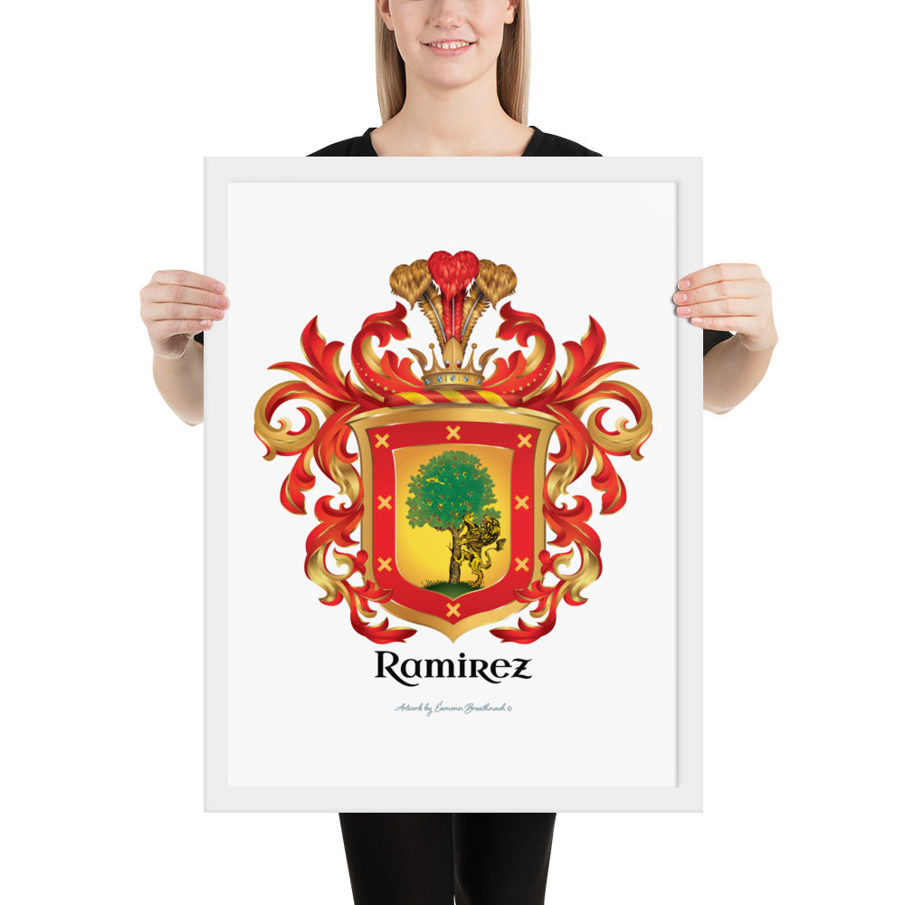 A woman holding a white-framed print of the Ramirez Family Crest featuring a lion and an oak tree.