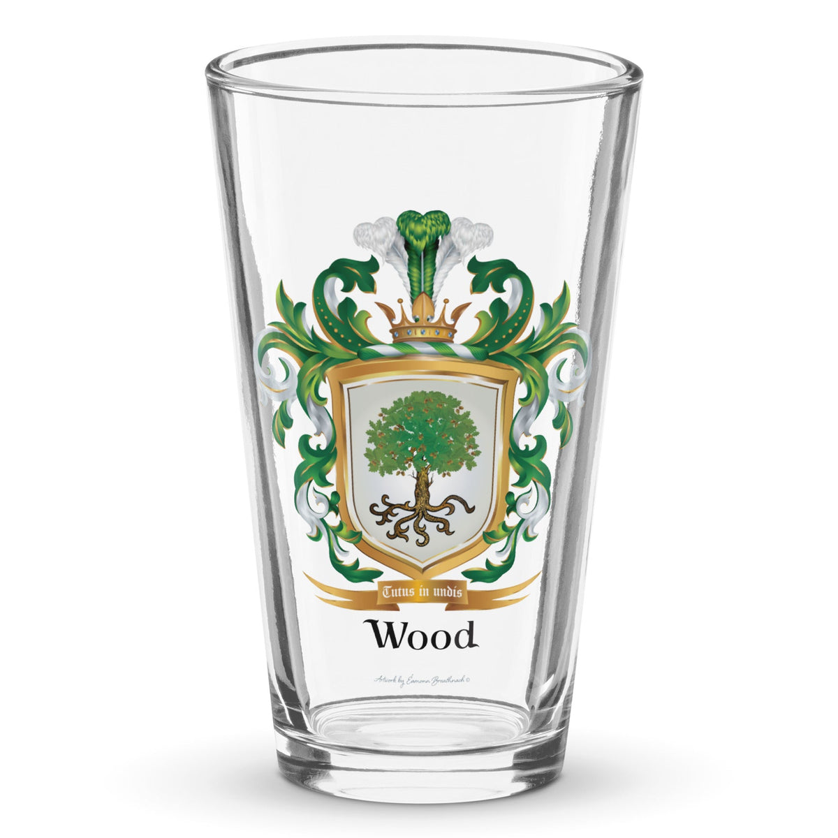 A clear classic pint beer glass on a white background, printed with the Wood Family Crest featuring a white shield and an oak tree.