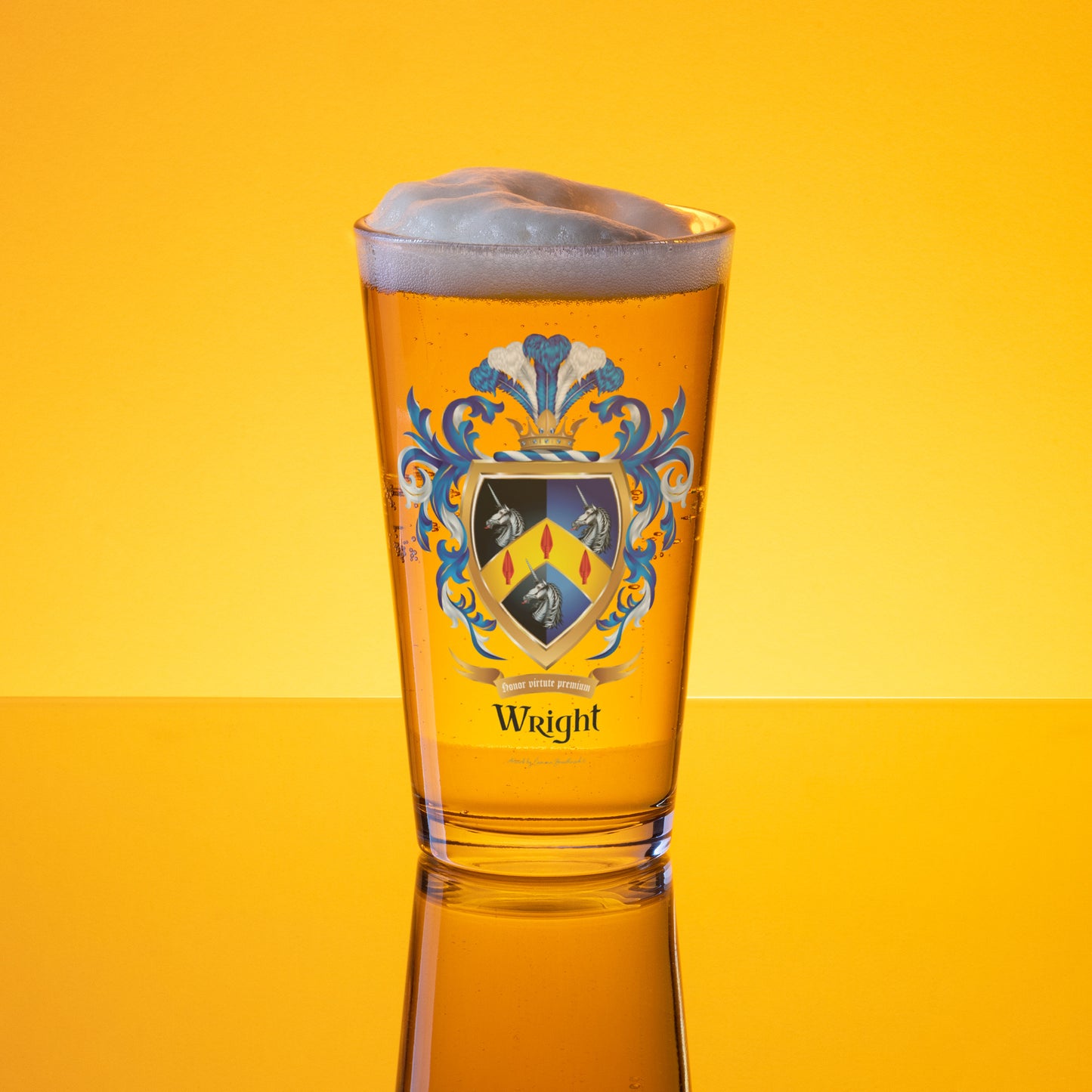 A clear pint glass filled with golden beer and topped with white foam, featuring a blue, yellow, and black Wright Family Crest crest design with the word 'Wright' below it, set against a bright yellow background.