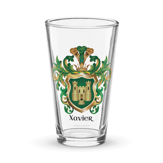 Xavier Family Crest -pint-glass featuring a gold castle on a green shield and the name Xavier in black below