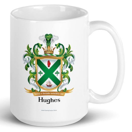 A white mug with handle to right, on a white background, printed with the Irish Hughes Family Coat of Arms featuring a green and white shield, a gold border, 2 green shamrocks, a s sailing ship, a gold motto scroll reading ‘Justitia et fortitudine invincibilia sunt’, and the name ‘Hughes’ below inheraldic style black text on a white background.