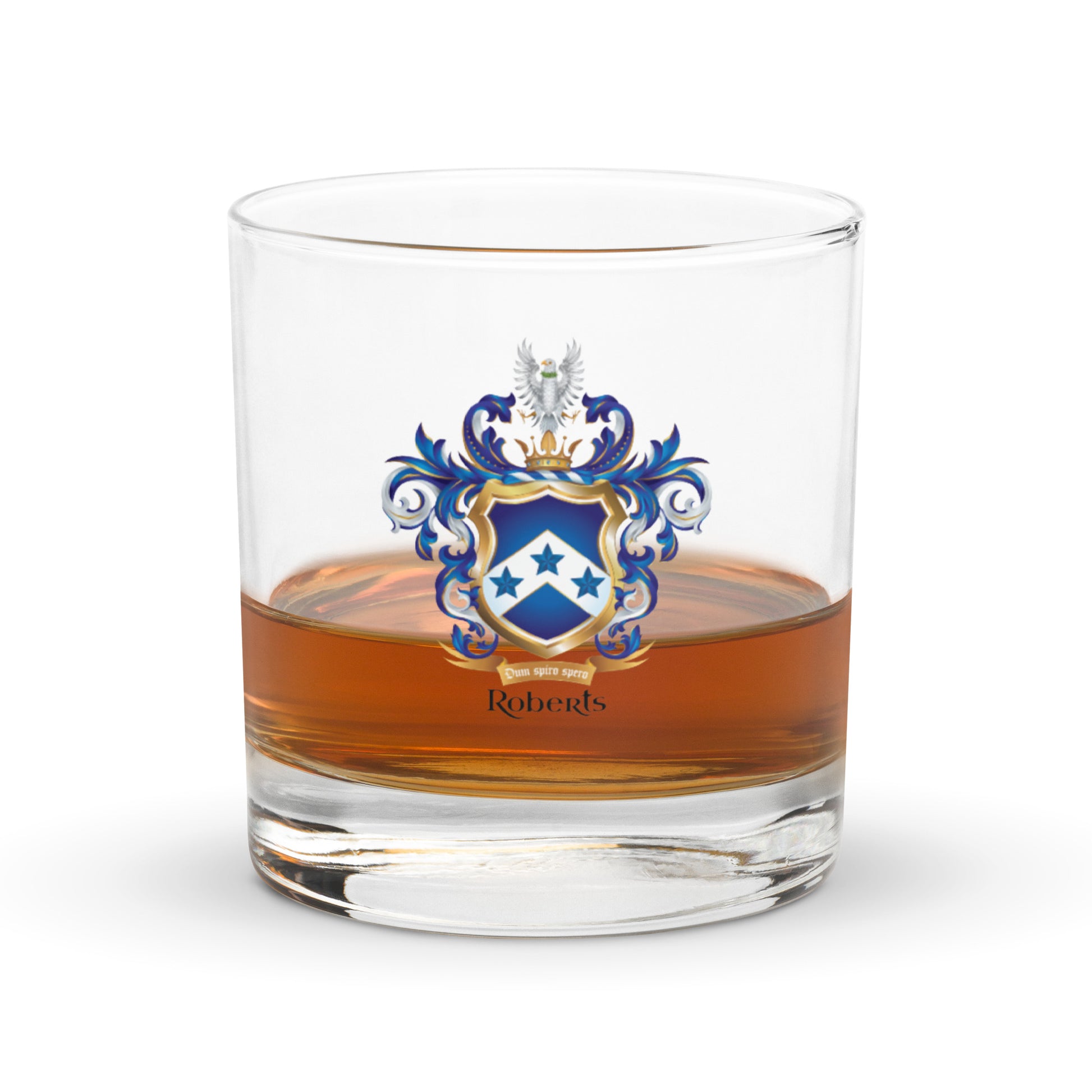 Half full glass of amber liquid with a Roberts coat of arms emblem on a white background