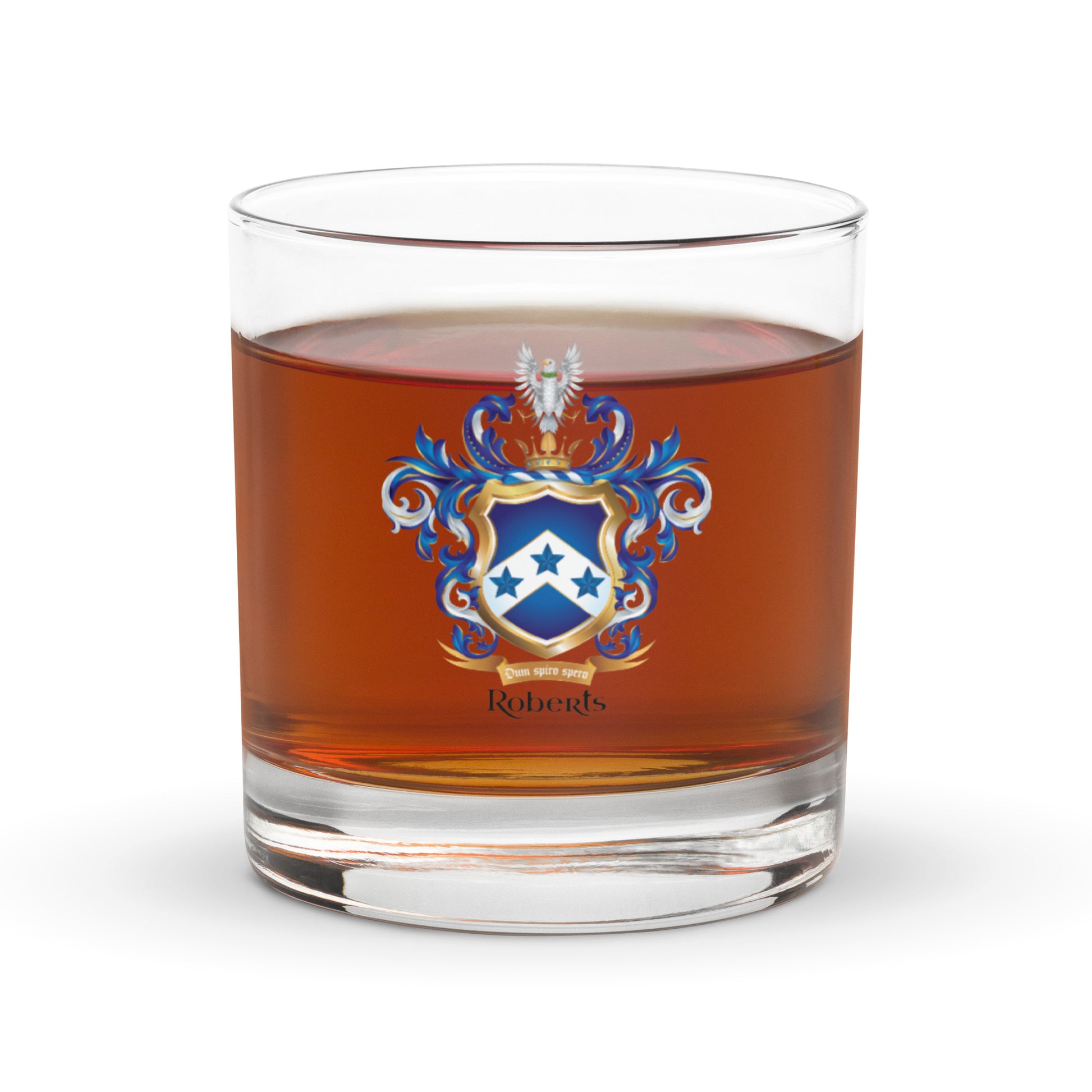 Glass of amber liquid with a Roberts coat of arms emblem on a white background